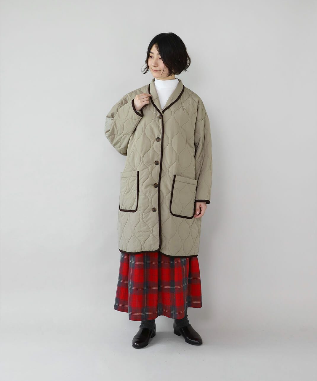 YURK geniet vanショールカラーのパイピングキルティングコート