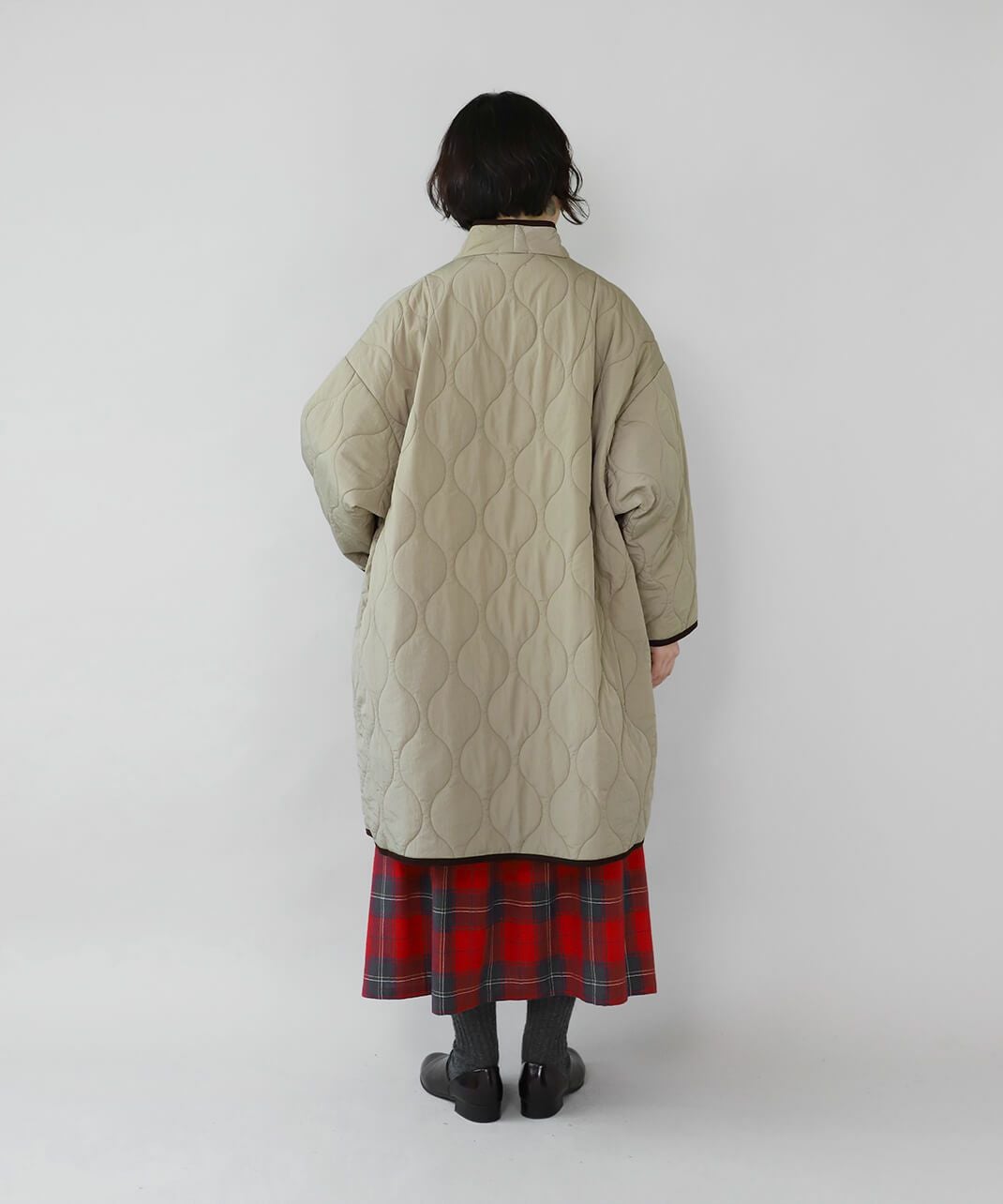 YURK geniet vanショールカラーのパイピングキルティングコート